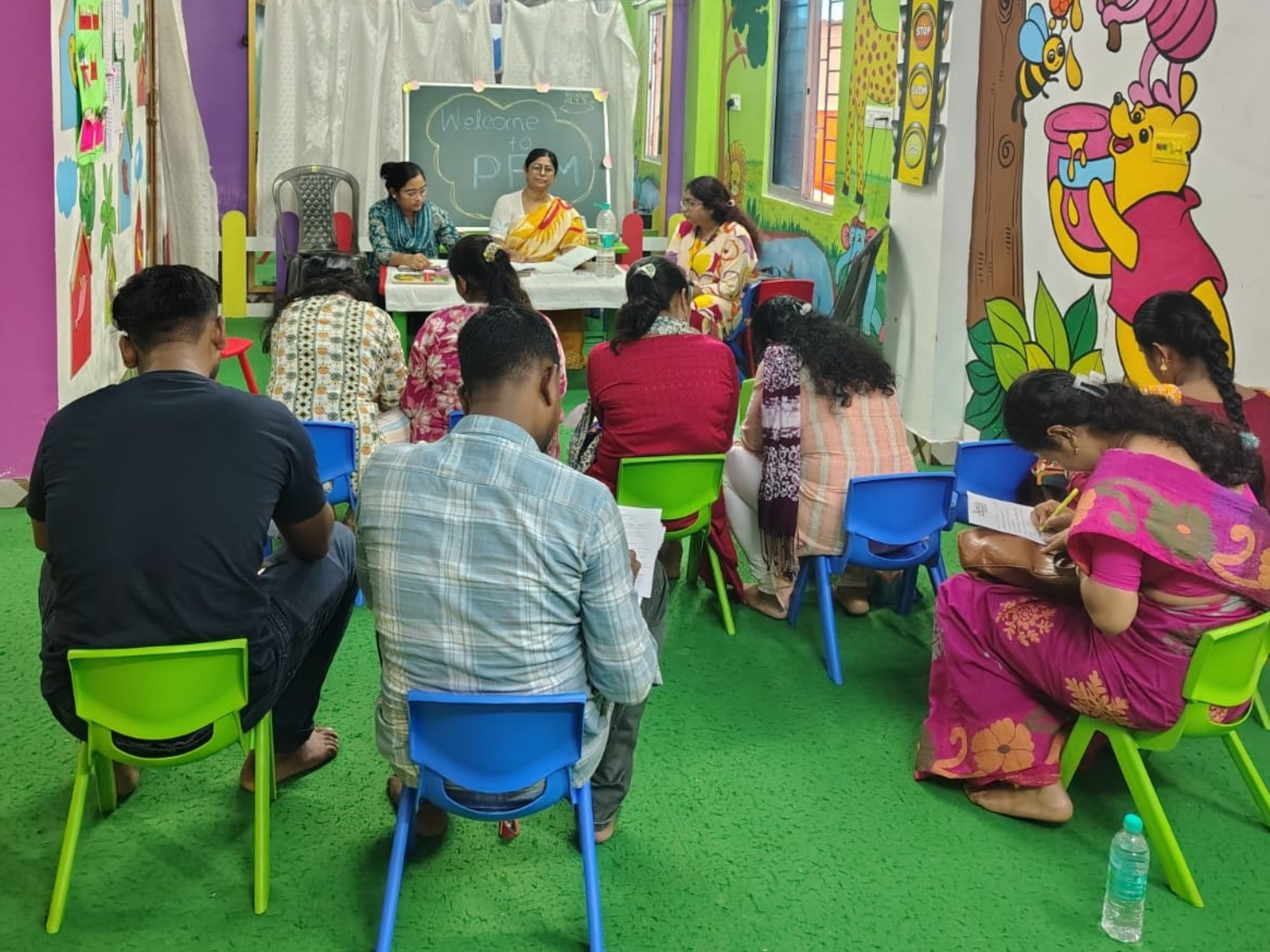 Teacher interacting with parents during school event
